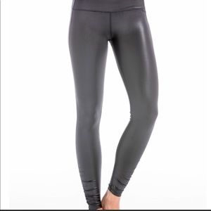 PB shiny leggings with pure barre decal on leg